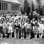 Ymir School 1953 Row 1: Wayne Anderson, Jimmy Lang, Preston Zebin, Harry McDonald, Wayn Kinee, Gary Gowing, Dale Tetz, Billy Williams. Row 2: Ronald Ekstrom, David Smith, Anne Kosenic, Virginia Lundgren, Nick Bowolin, Leo Ritter, Heather Medine, John Edwardson, Diane Borg